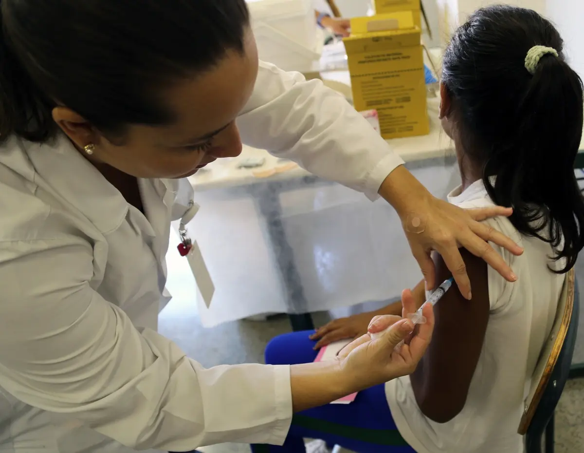 Nurse applying vaccine