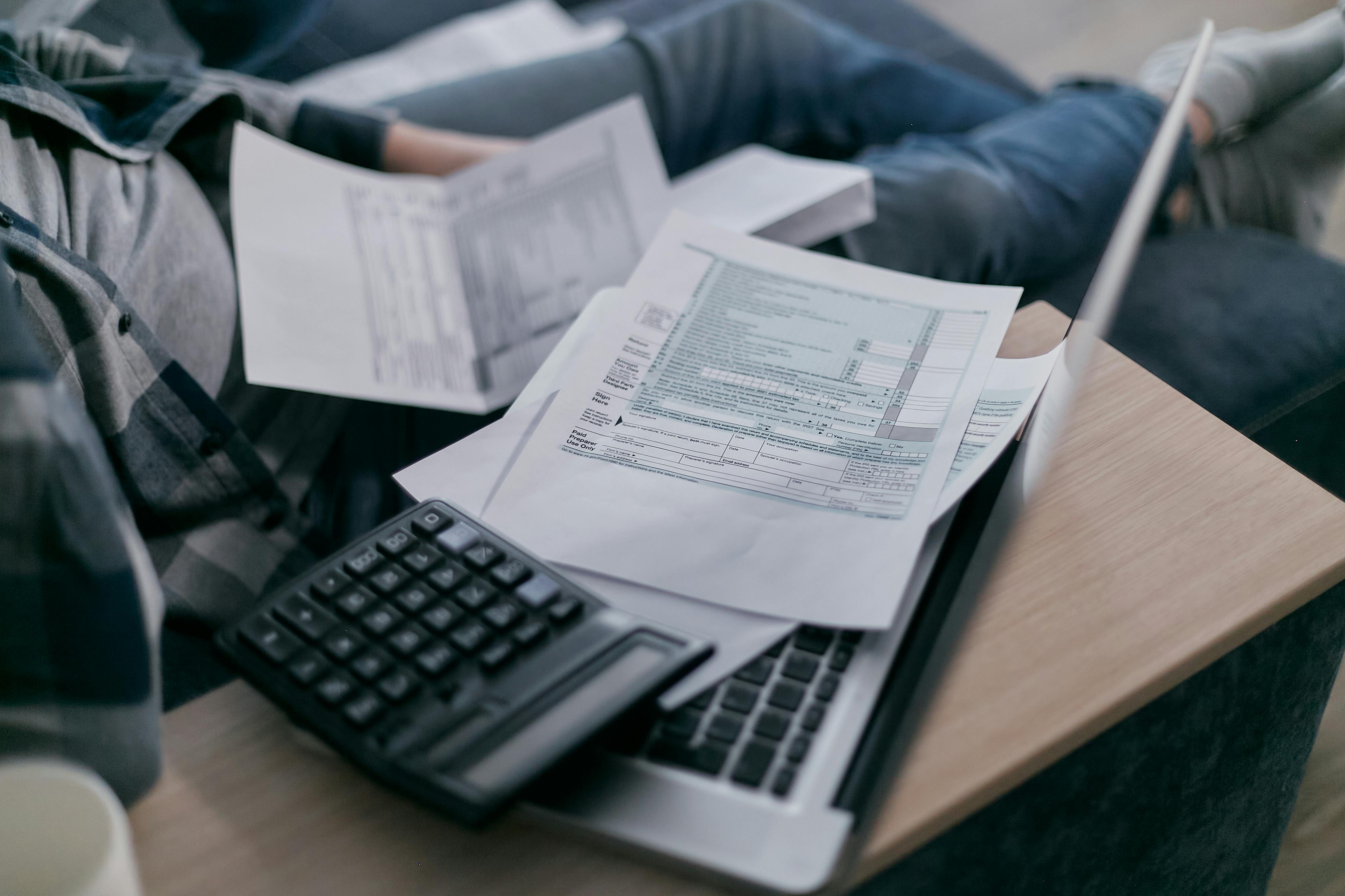 Two people reviewing tax forms